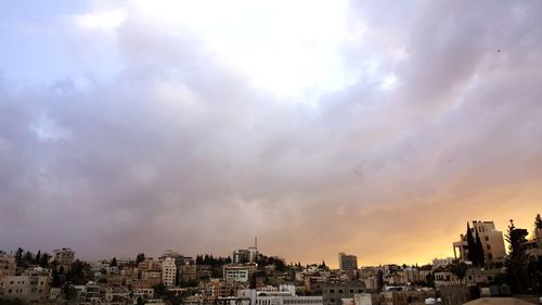 Panoramic view of buildings against sky during sunset