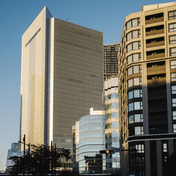 Low angle view of modern buildings against sky