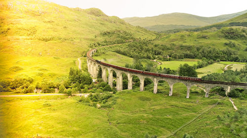 View of bridge on landscape against mountain