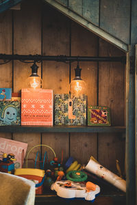 Illuminated candles on wall