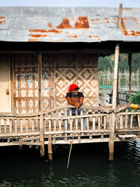 Man on pier by lake