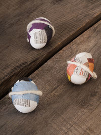 Close-up of paper ball on sand