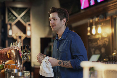 Bartender working at bar