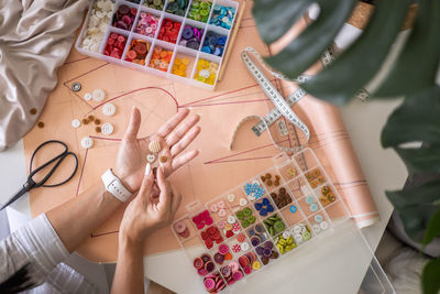 Midsection of woman using digital tablet