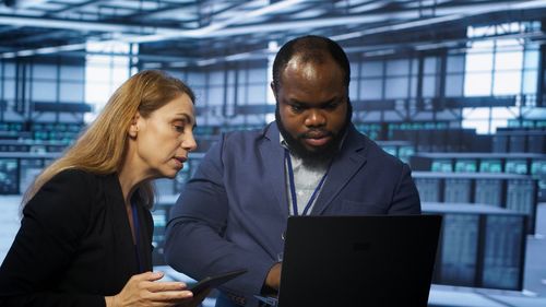 Portrait of smiling business colleagues working at office