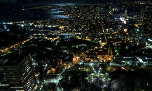 High angle view of city lit up at night