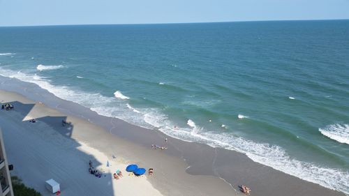 Panoramic view of beach against clear sky