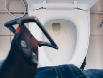 Midsection of person sitting in airplane