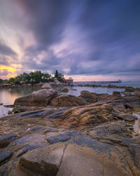 Scenic view of sea against sky at sunset