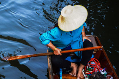 An old lady floating market in bangkok