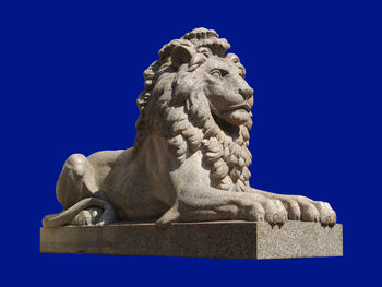 Close-up of statue against blue sky