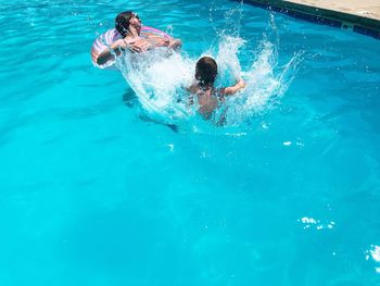 Man swimming in pool