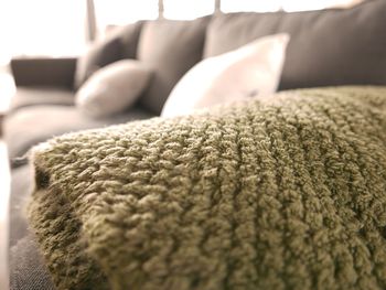 Close-up of throw blanket on sofa at home