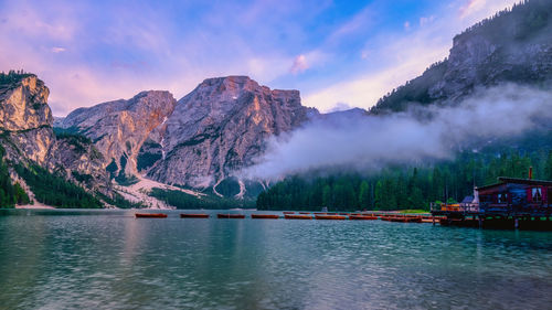 Scenic view of lake and mountains against sky