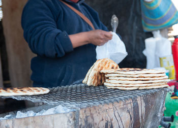 Close-up woman preparing tortillas 