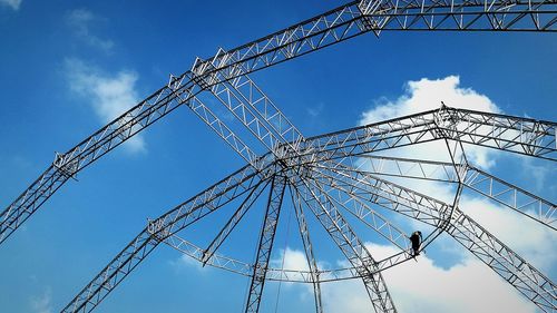 Low angle view of metal structure against sky