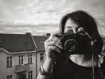 Woman photographing through smart phone