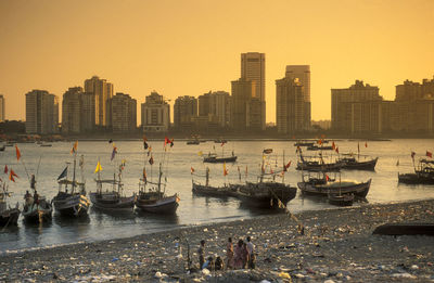 Boats moored at harbor