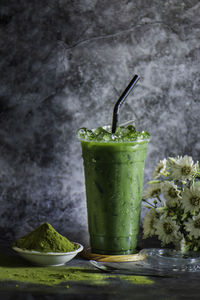 Iced green tea in a plastic glass with ice