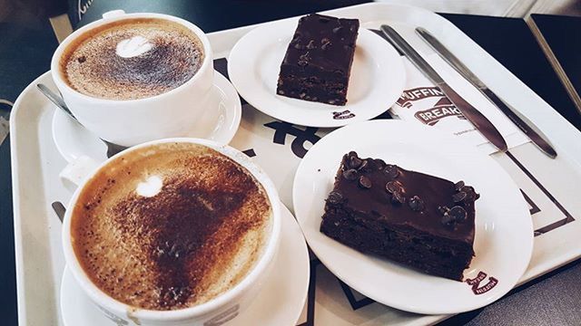 food and drink, coffee cup, drink, freshness, coffee - drink, refreshment, indoors, saucer, table, coffee, food, still life, frothy drink, plate, breakfast, cup, ready-to-eat, high angle view, cappuccino, sweet food