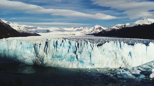 Scenic view of frozen landscape against sky