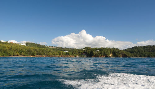 Scenic view of sea against blue sky