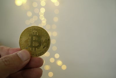 Close-up of hand holding coins