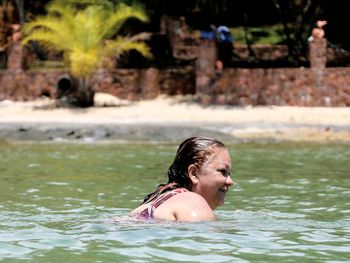 Woman swimming in sea