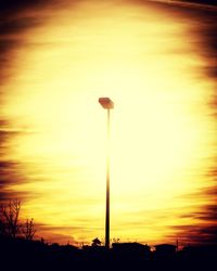 Silhouette trees against sky during sunset