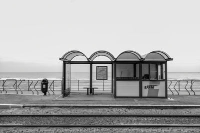 Man standing by sea against clear sky