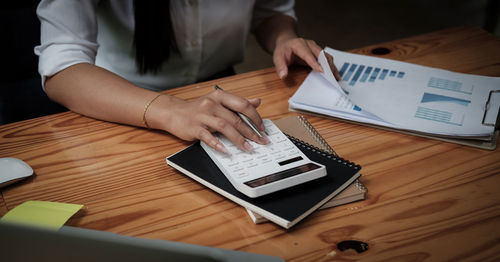 High angle view of man using laptop on table
