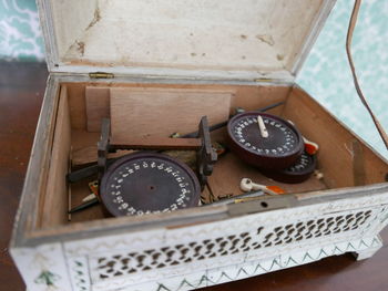 High angle view of clock on table