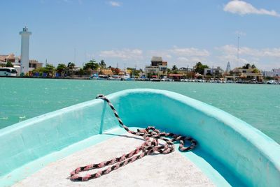 Swimming pool by sea against sky