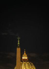 Illuminated building against sky at night