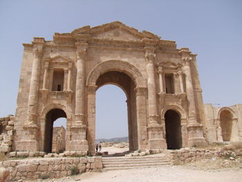 Low angle view of old ruins against clear sky