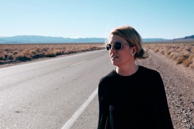 Portrait of man wearing sunglasses against clear sky