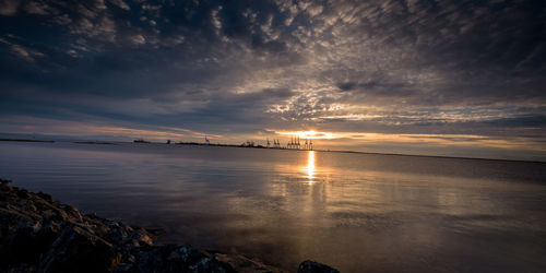 Scenic view of sea against sky at sunset