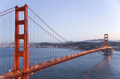 Golden gate bridge in city against clear sky