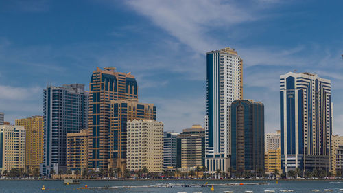 Modern buildings in city against sky