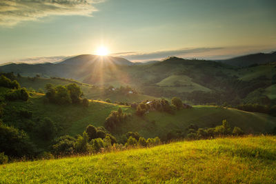 Scenic view of landscape against sky during sunset