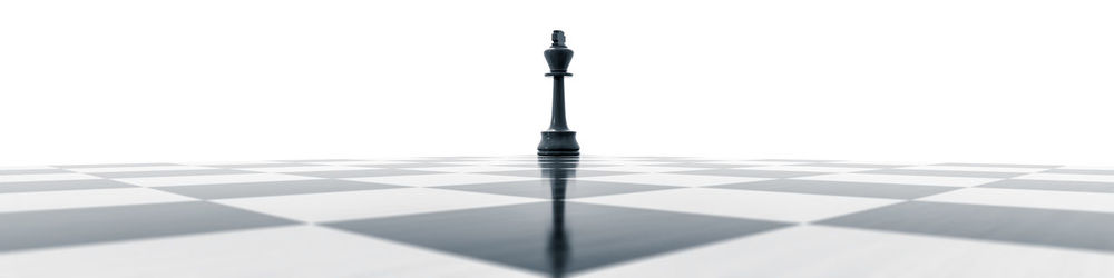 Close-up of chess board against white background