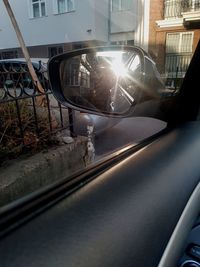 Reflection of building on car window