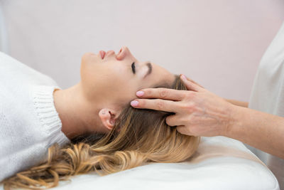 Portrait of woman sleeping on bed at home