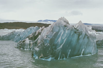 Scenic view of frozen sea against sky