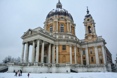 Building against sky during winter