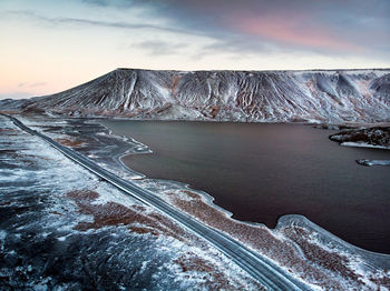 Scenic view of snowcapped mountains against sky during winter