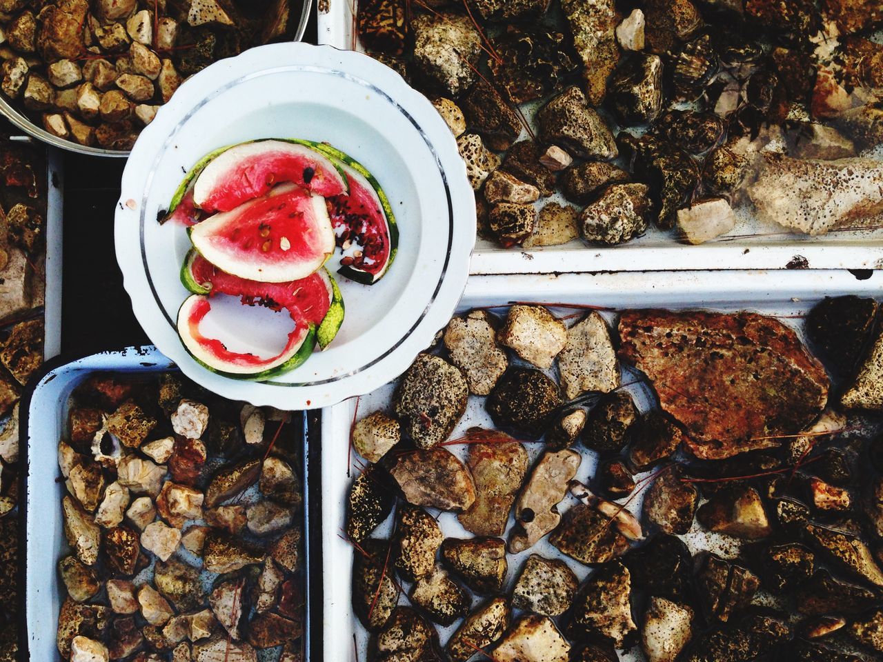 food and drink, food, freshness, high angle view, fruit, sweet food, healthy eating, abundance, cold temperature, large group of objects, day, red, outdoors, still life, stone - object, close-up, indulgence, dessert, ready-to-eat