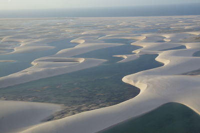 Aerial view of snow covered land