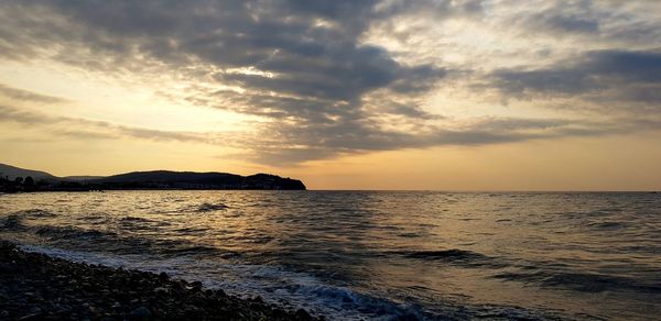 Scenic view of sea against sky during sunset