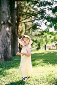 Full length of a girl standing on field